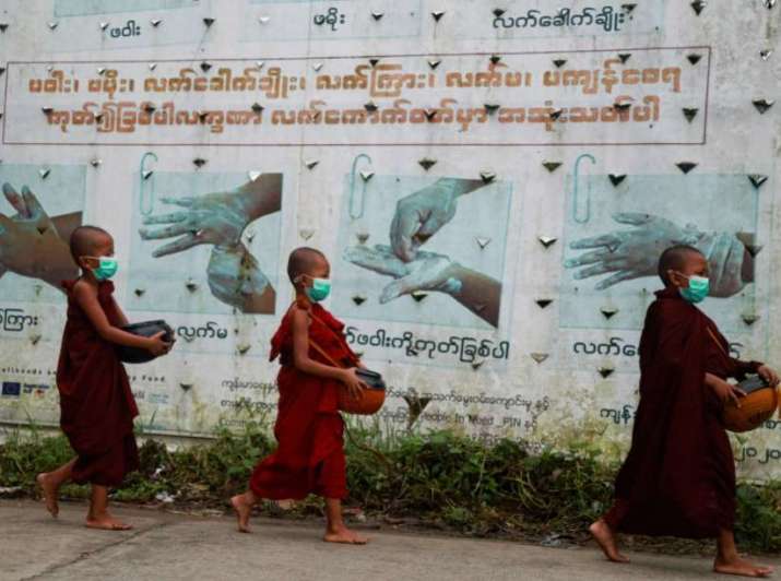 Young monks pass by hygiene instructions in Yangon. From michiganradio.org