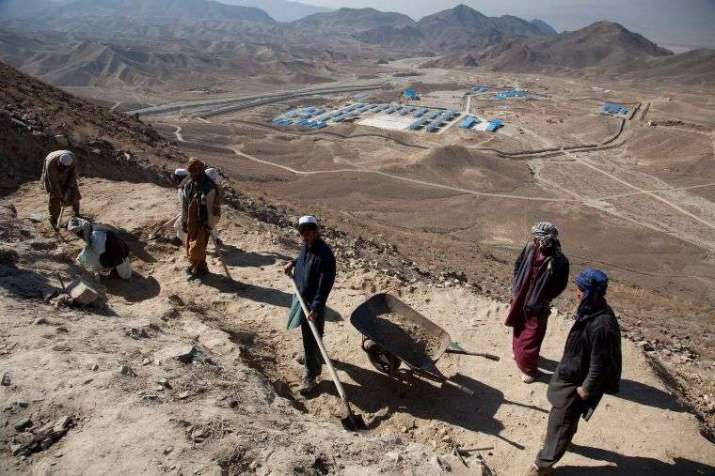 A Chinese mining camp stands in the valley below while Afghan archeologists work at Mes Aynak. From theartnewspaper.com