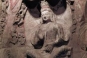 Lu-style niche with a bound curtain embellishment houses a Buddha in meditation. This sculpture is on the west wall of the back chamber of Cave 7.