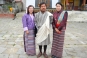 Julia and Victoria join the locals in native dress (kira for women, gho for men). Location: Karchu Dratshang Monastery © Dorothy Ko