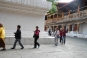 Pilgrims circling stupa inside first courtyard, Punakha Dzong © Dorothy Ko