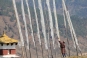 Groups of white flags honoring the dead across the landscapes © Venerable Si Hua