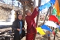 Tying flags on Yotongla Pass © Buddhistdoor