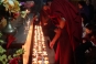 LIghting candles during evening chants at Dechen Phodrang, Thimphu © Buddhistdoor